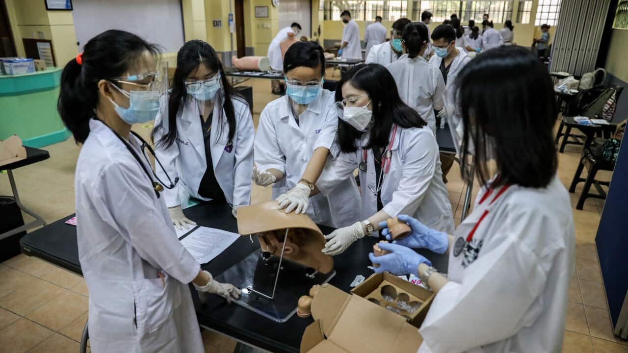 Medical students attend university classes in Philippines
