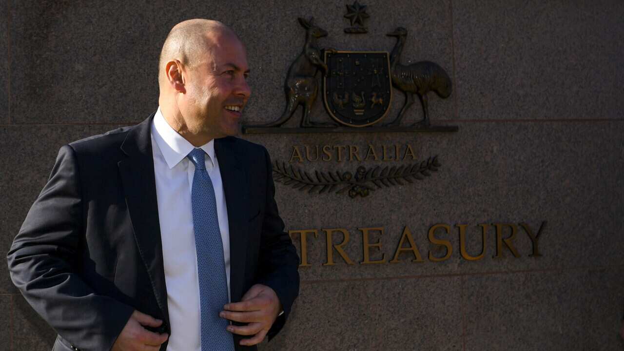 Australian Treasurer Josh Frydenberg poses for photographs outside the Treasury building in Canberra, Monday, May 10, 2021. Treasurer Josh Frydenberg will hand down his third budget tomorrow. (AAP Image/Lukas Coch) NO ARCHIVING