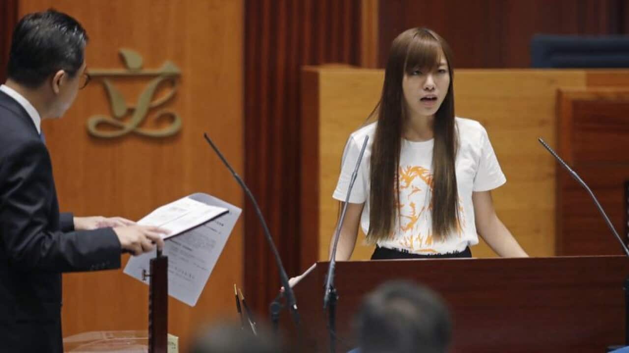 Newly elected lawmaker Yau Wai-ching of Youngspiration takes oath in the new legislature Council in Hong Kong