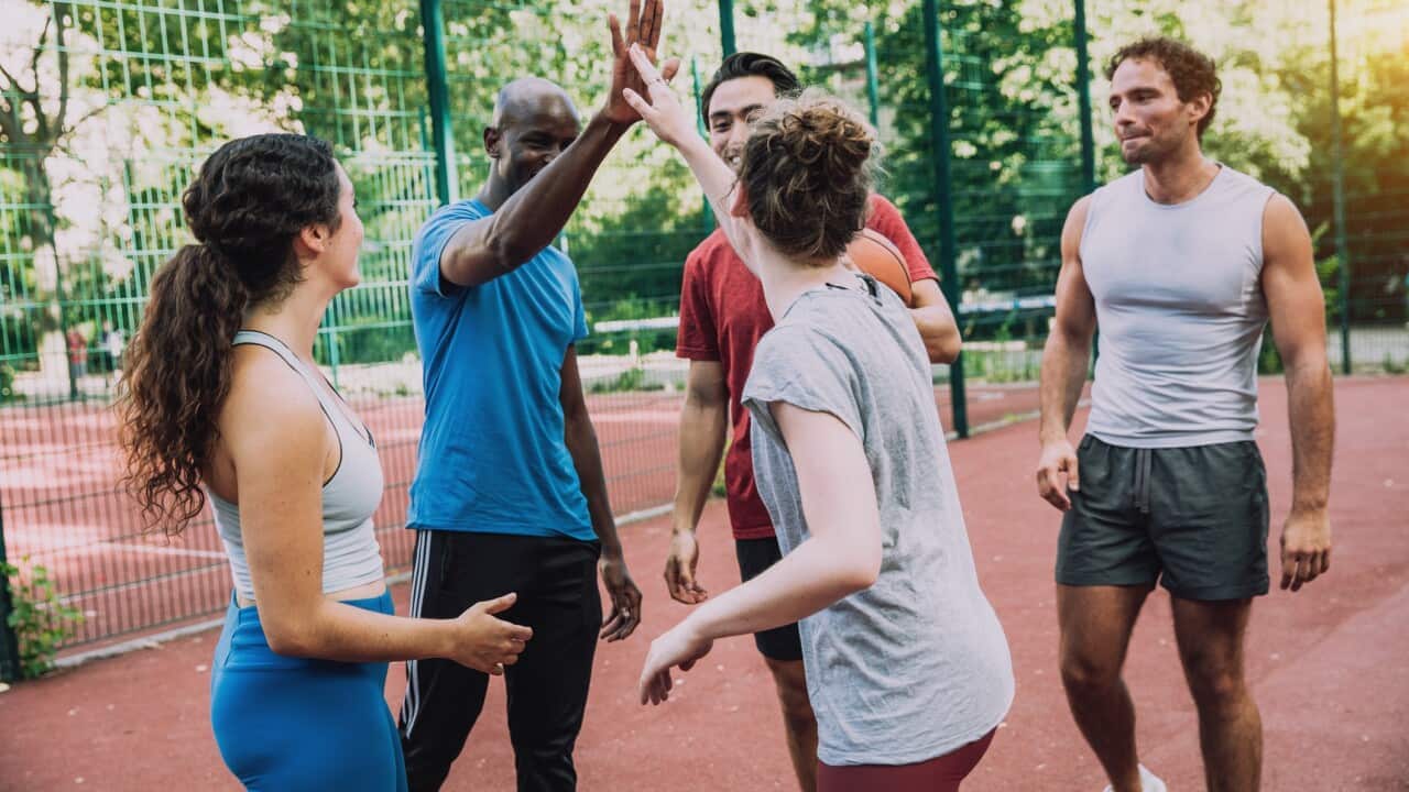 Young sports people hanging out together .png
