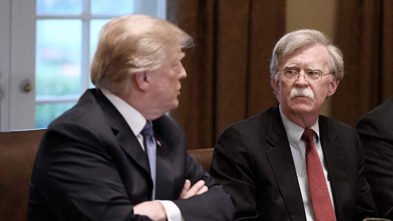 File photo dated April 9, 2018 of US President Donald Trump (L) and John Bolton (R)