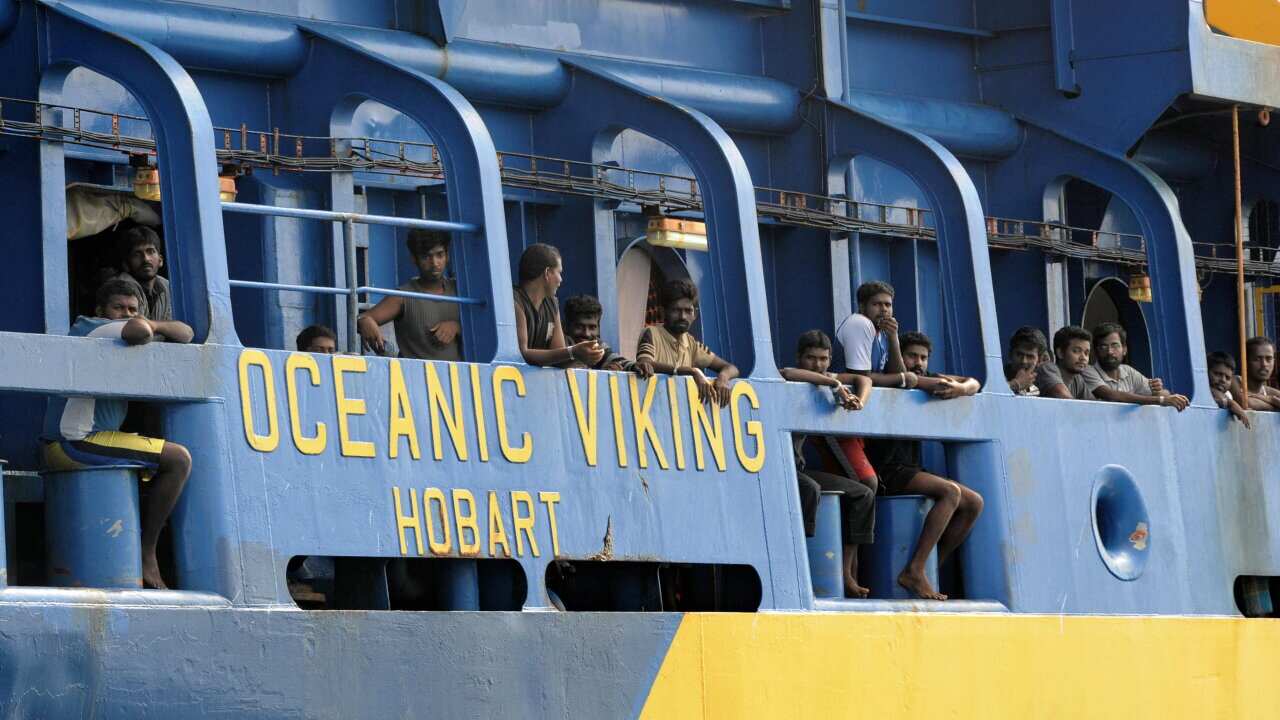 Sri Lankan asylum seekers on tan Australian Customs vessel anchored off Indonesia's Riau Island of Tanjung Pinang in 2009 - AAP-2.jpg