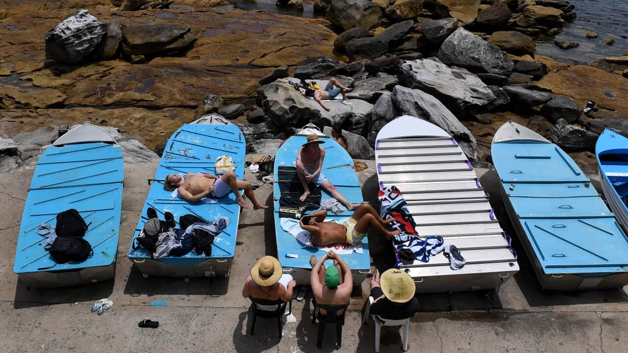 People take to the water at Bondi Beach during a hot day in Sydney, Sunday, December 19, 2021. Temperatures in NSW have exceeded 30C, as a heatwave moves across the country. (AAP Image/Bianca De Marchi) NO ARCHIVING