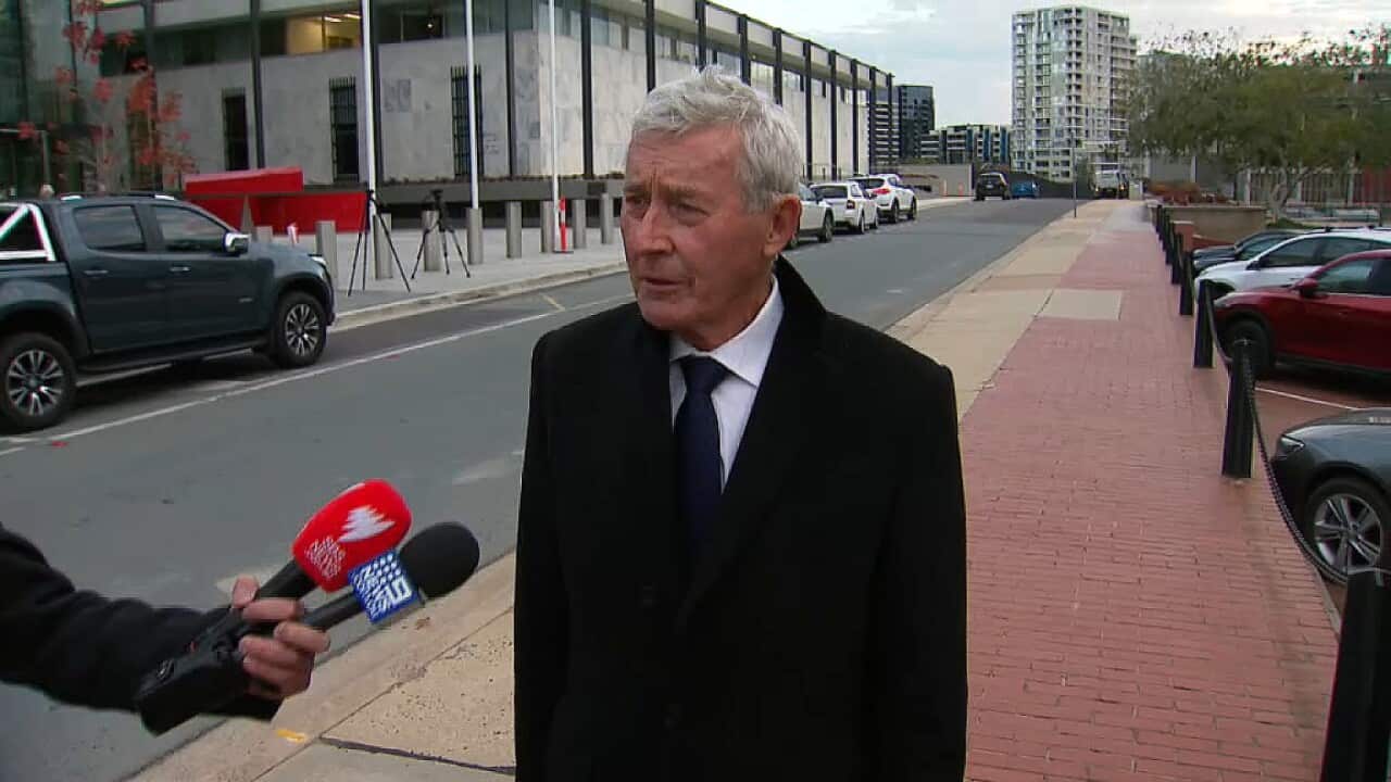 Lawyer Bernard Collaery on his way into court in Canberra