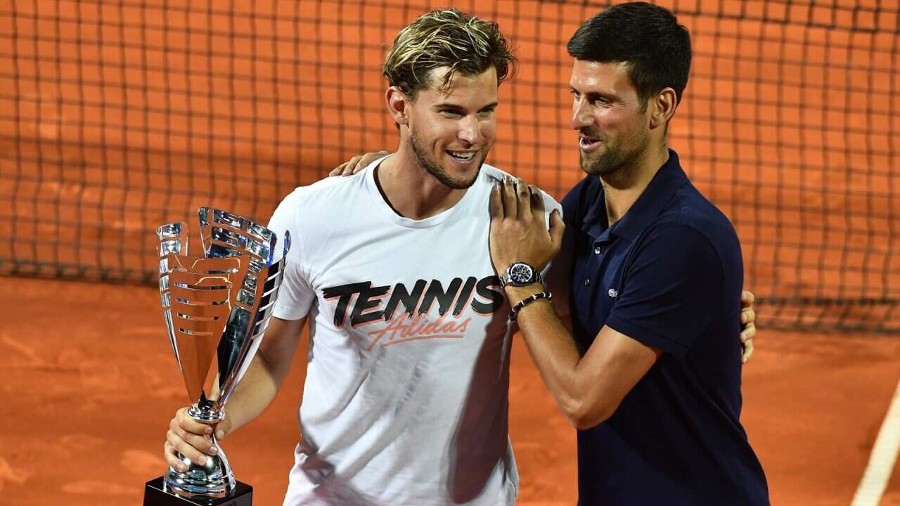 Dominic Thiem (L) of Austria and Novak Djokovic during medal ceremony of the Adria Tour tennis tournament in Belgrade, Serbia on June 14, 2020. Dominic Thiem won in final match against Filip Krajinovic.