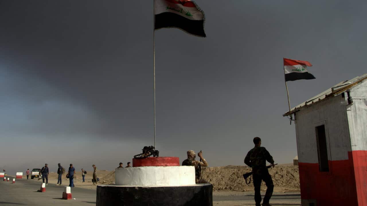 smoke from fires lit by Islamic State militants at oil wells and a sulfur plant fills the air