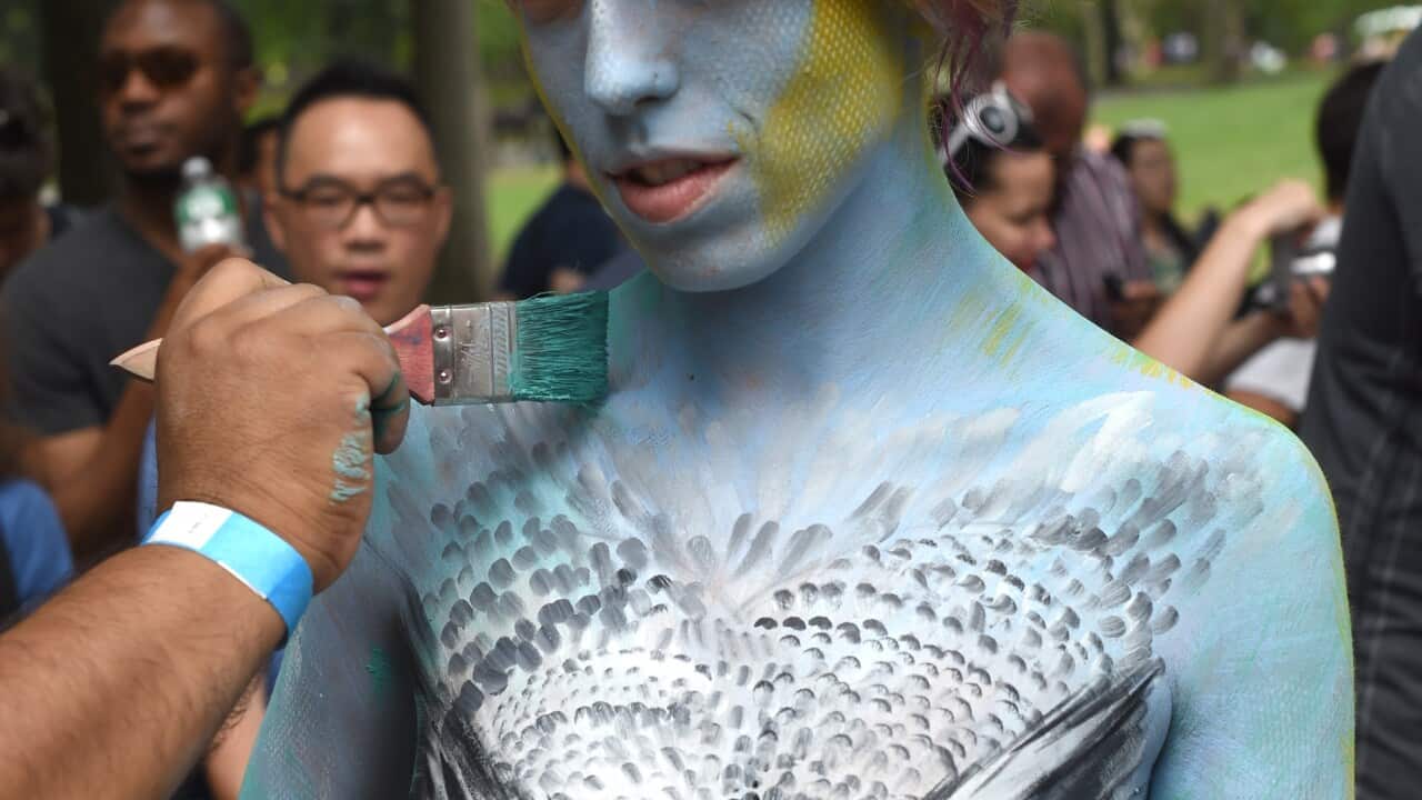 Nude models were painted in New York's Central park today by artists in a tribute to the human body. (Getty)
