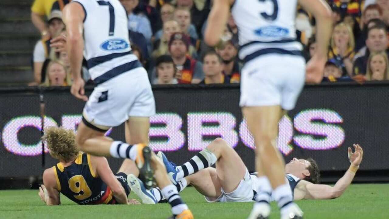 Rory Sloane of the Crows collides with Patrick Dangerfield