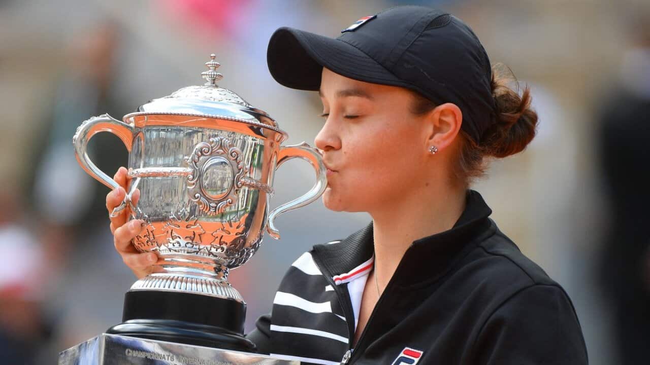 Australia's Ashleigh Barty poses with the trophy after winning against Czech Republic's Marketa Vondrousova at the end of the women's singles final match.