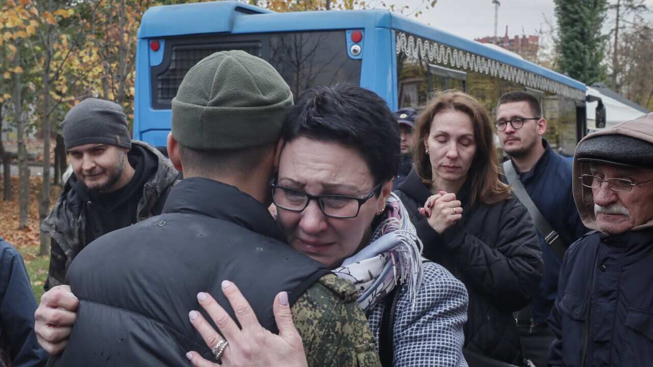 Russian conscripted man says goodbye to relatives at a recruiting office during Russia's partial military mobilization in Moscow, Russia, 12 October 2022.