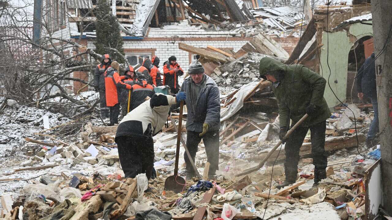 People clearing debris.