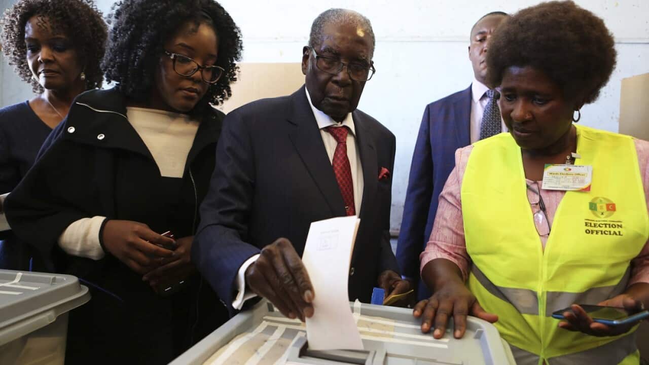 Former Zimbabwean Leader President Robert Mugabe casts his vote.