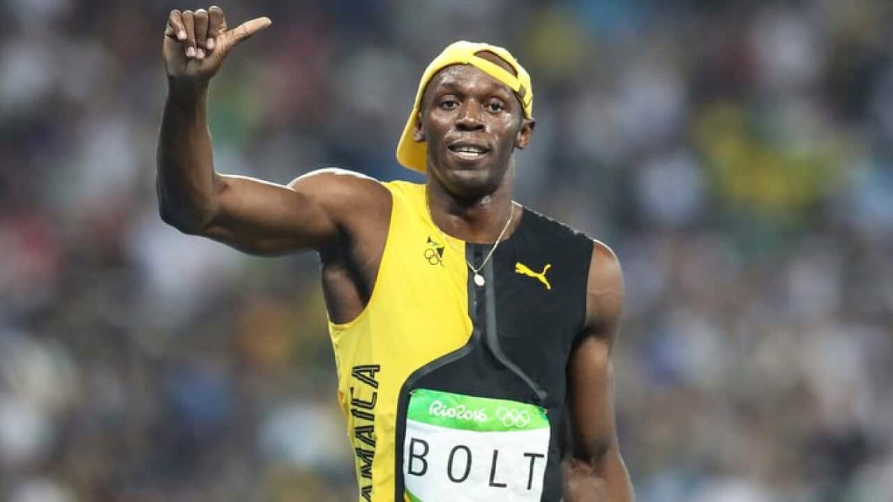 Usain Bolt of Jamaica celebrates winning the Men's 100 meter final