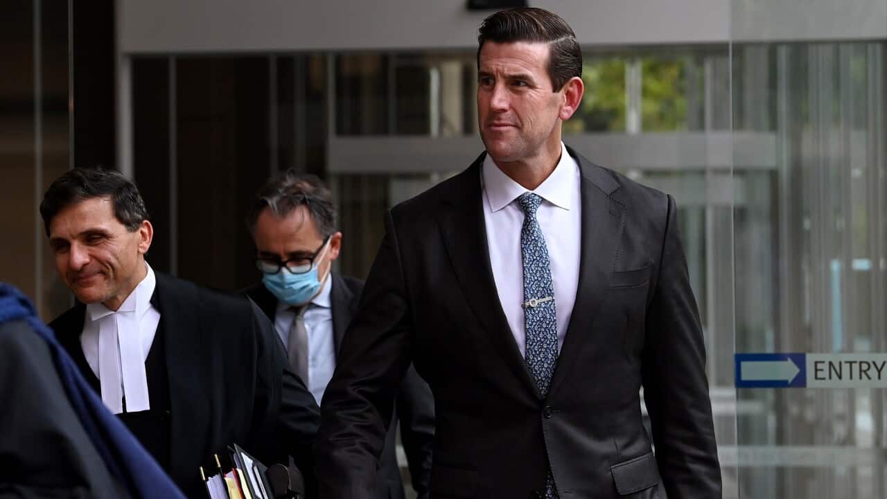 Ben Roberts-Smith (right) leaves the Federal Court in Sydney on 1 March 2022.