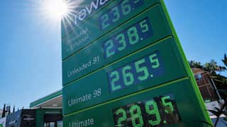 A close up of a petrol station price board with unleaded 98 at 265.5c