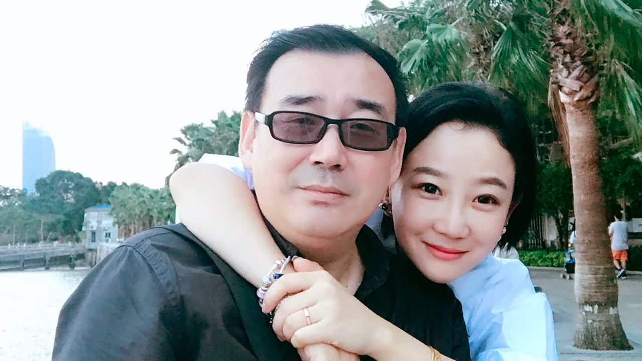 Yang Hengjun, left, poses with his family member in Beijing.