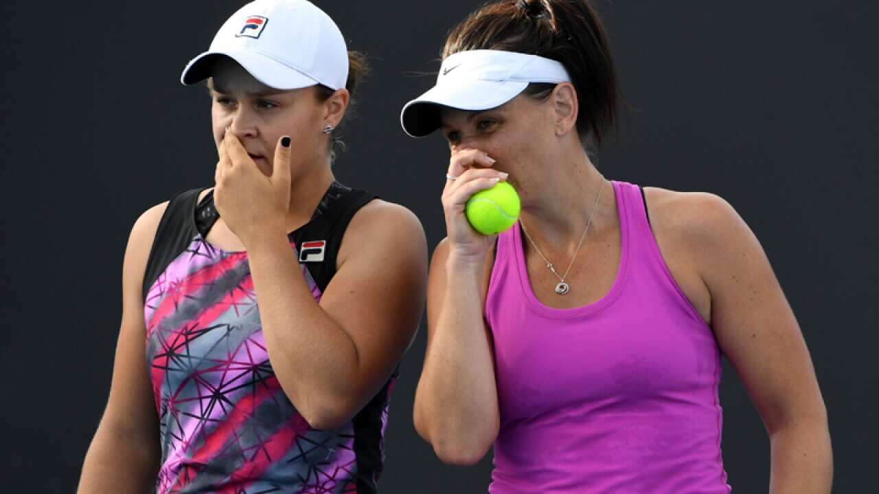 Australian doubles pairing Ashleigh Barty (L) and Casey Dellacqua