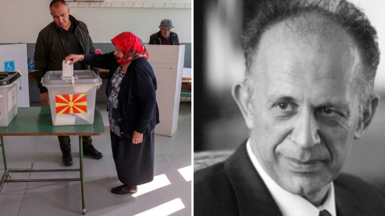 A woman casts her vote in a referendum on the country's name change at a polling station in the village of Zajas.