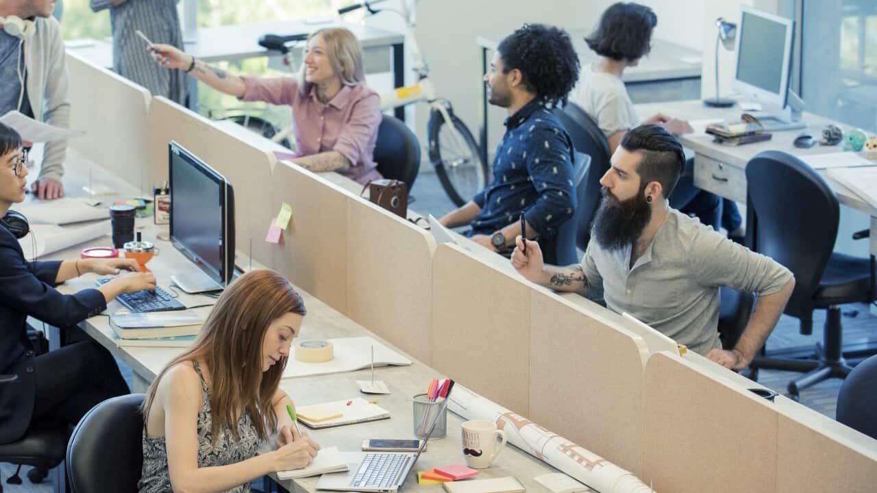 Professionals coworking in shared office space