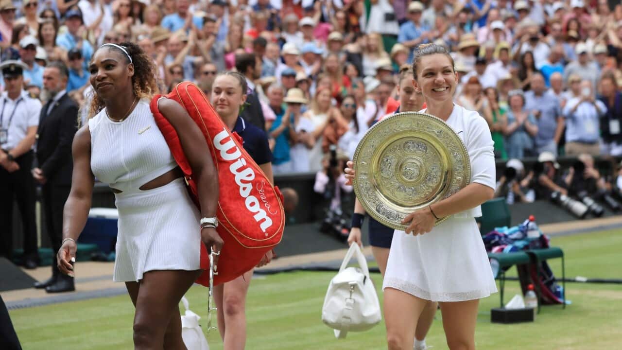 Simona Halep of Romania and Serena Williams of U.S.A. leave the center court after the ladies' singles final of the Championships, Wimbledon 