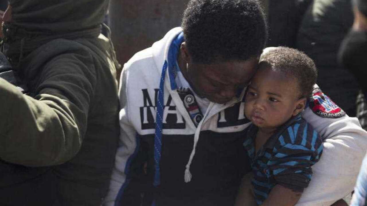 Migrants wait for medical attention on Wednesday, May 10, 2017 at Abosetta base in Tripoli, Libya.