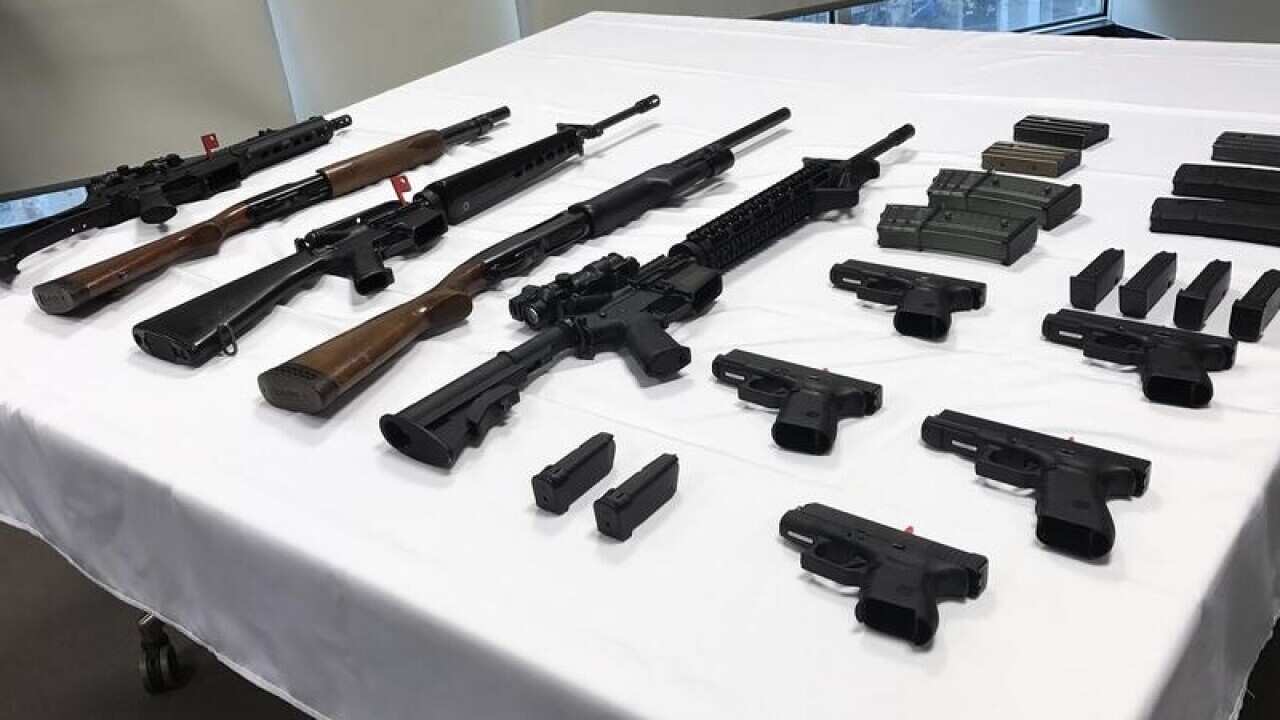 An array of guns in seen on a table in Canberra,