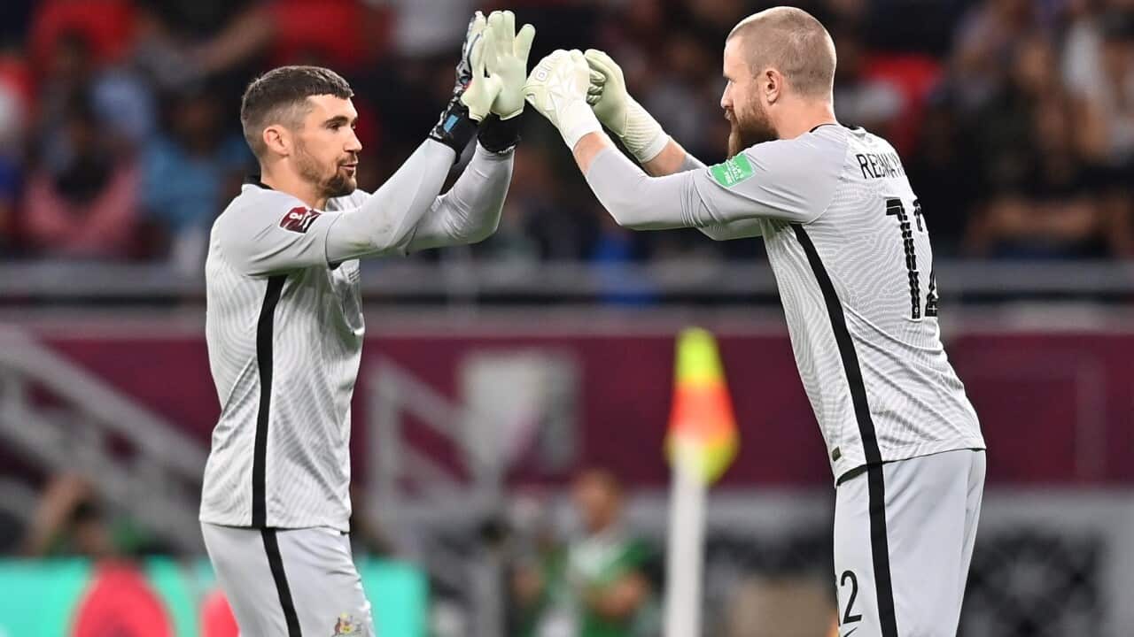 Australia's goalkeeper Mathew Ryan (L) is replaced by teammate Andrew Redmayne (R) (AAP).jpg