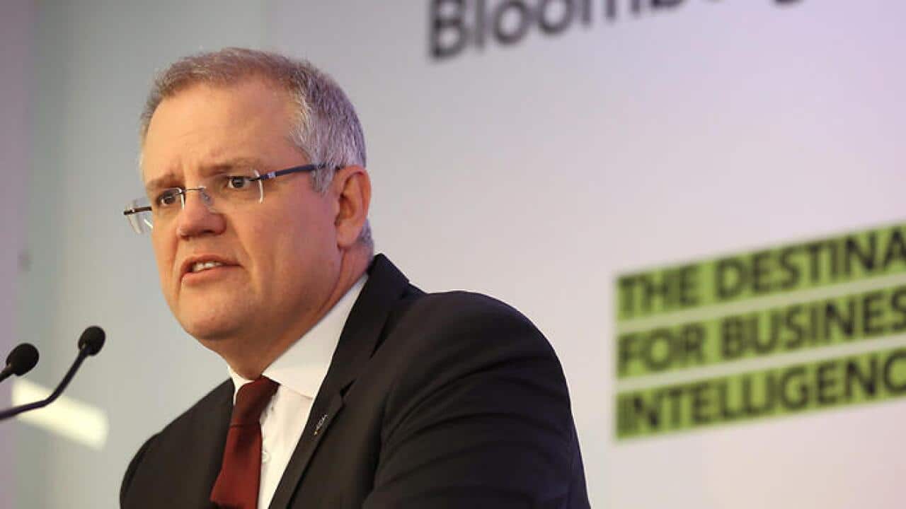 Australian Treasurer Scott Morrison stands at a podium as he delivers his Bloomberg address in Sydney, Wednesday, Aug. 25, 2016. (AAP Image/David Moir) NO ARCHIVING