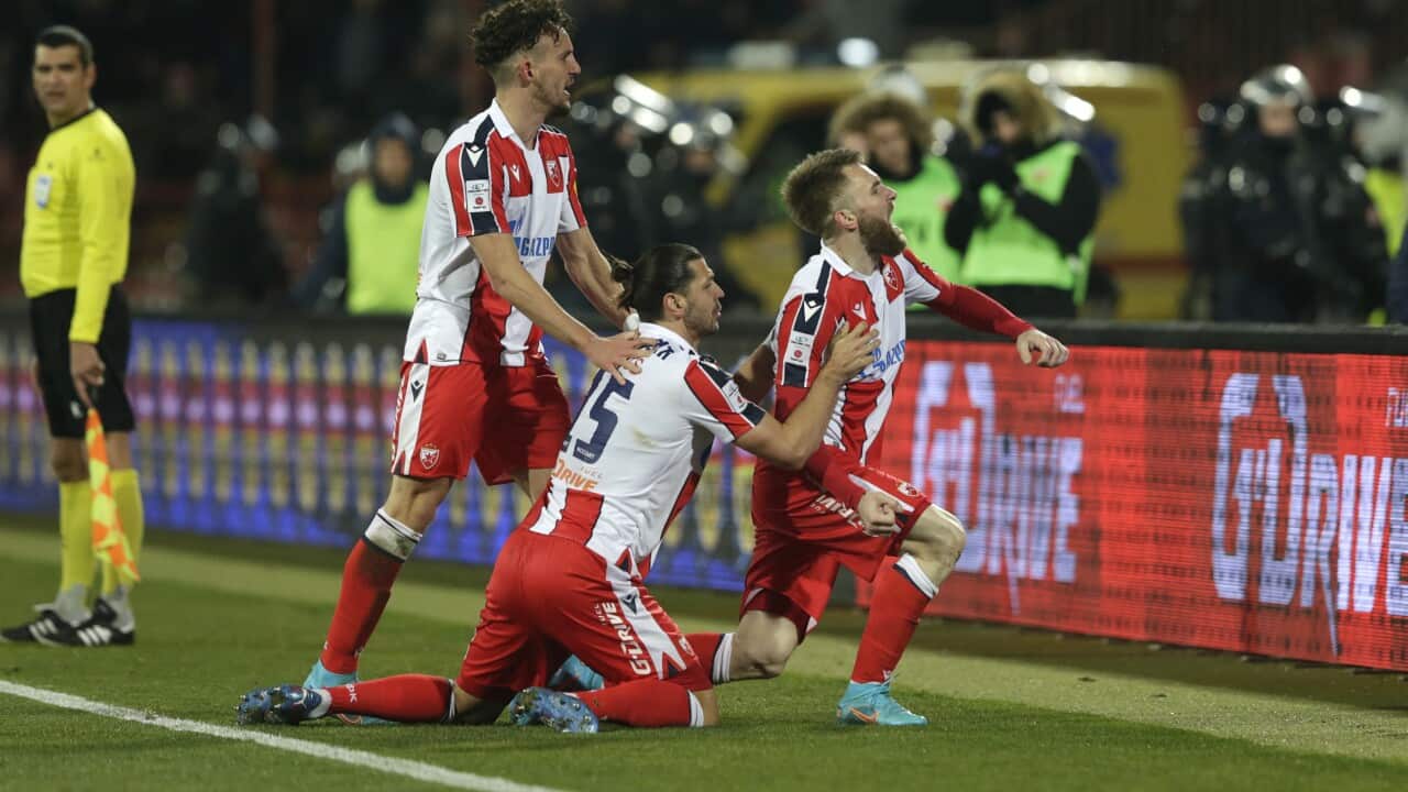 Red Star's Aleksandar Katai (R) celebrates with Aleksandar Dragovic (C) and Strahinja Erakovic (L) after scoring the 2-0 during the Serbian SuperLiga soccer match between Red Star and Partizan in Belgrade, Serbia, 27 February 2022. EPA/ANDREJ CUKIC