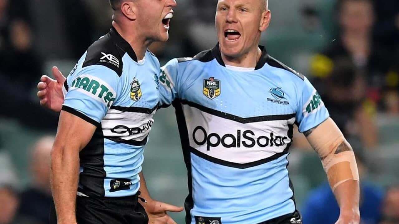 Cronulla rugby league star Luke Lewis (R)