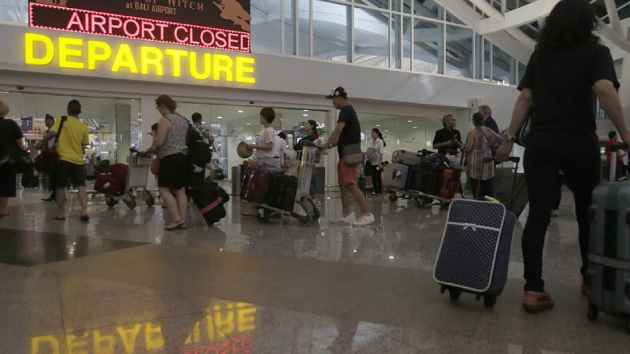 Passanger wait for their delayed flights at Bali International Airport