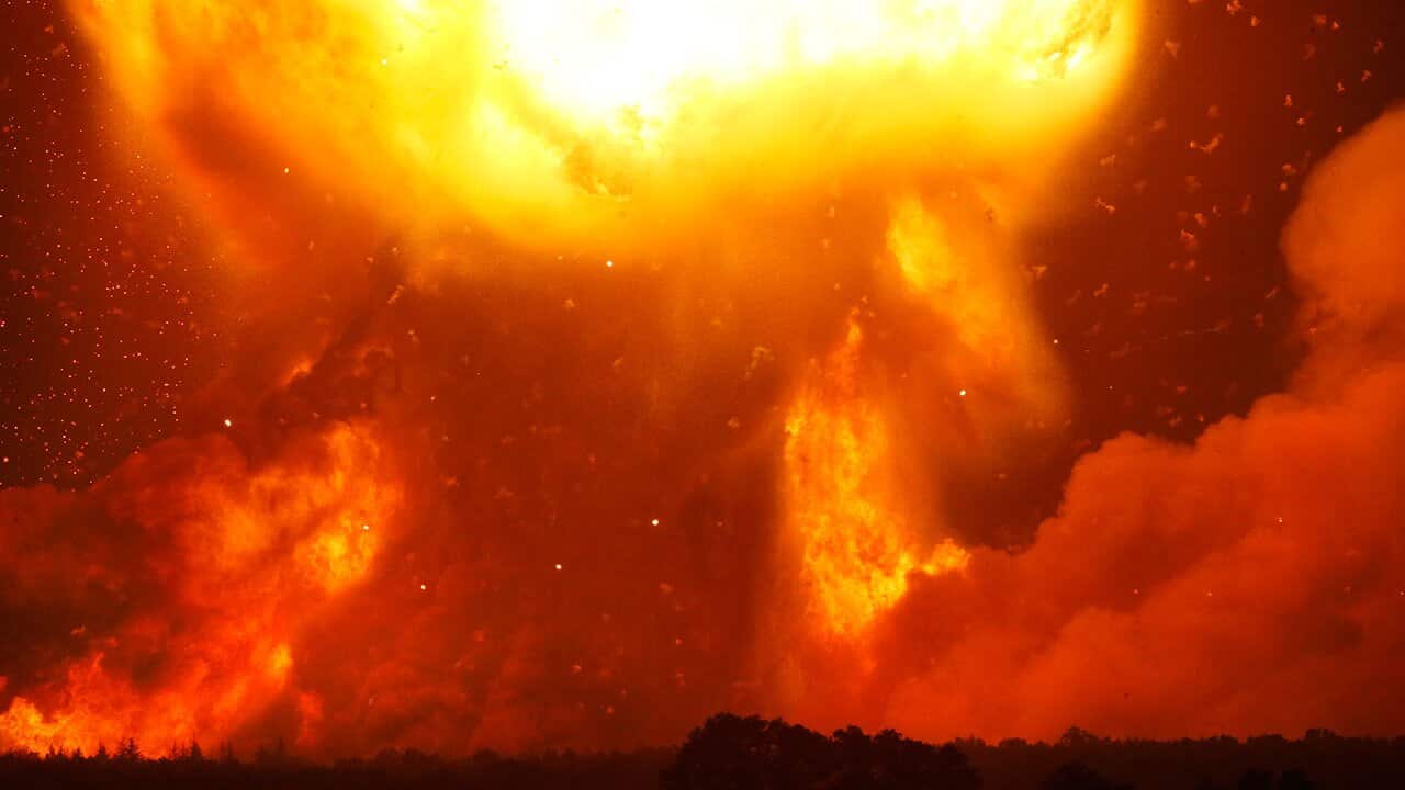 A powerful explosion is seen in the ammunition depot at a military base in Kalynivka, west of Kiev, Ukraine, early Wednesday, Sept. 27, 2017. 