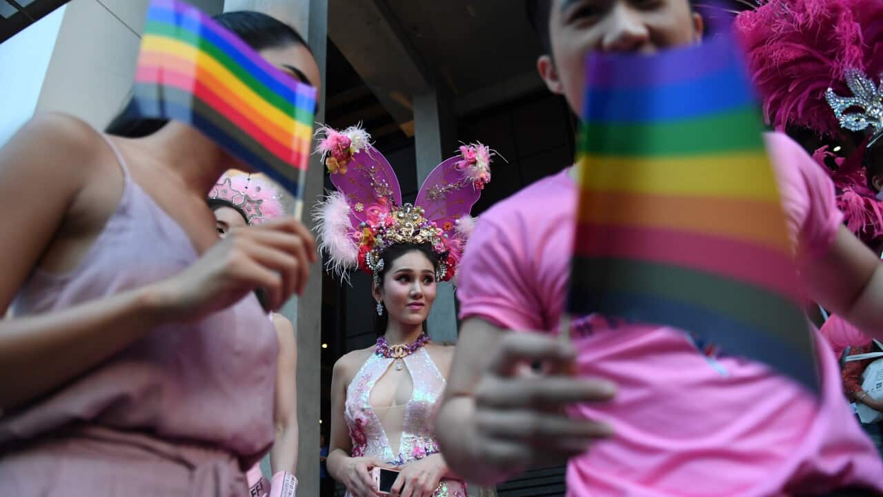 Participants wave rainbow flags during a rally advocating gay rights in Bangkok in 2018.