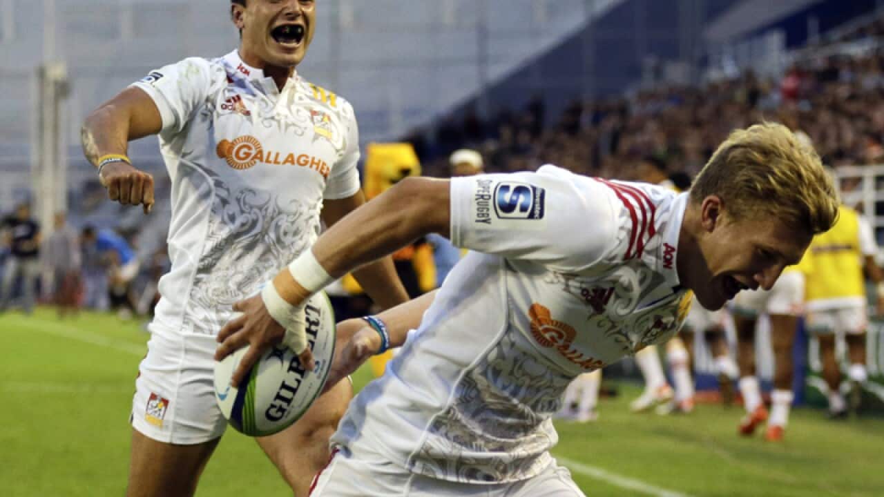 Chiefs' James Lowe, left, cheers on teammate Damian McKenzie