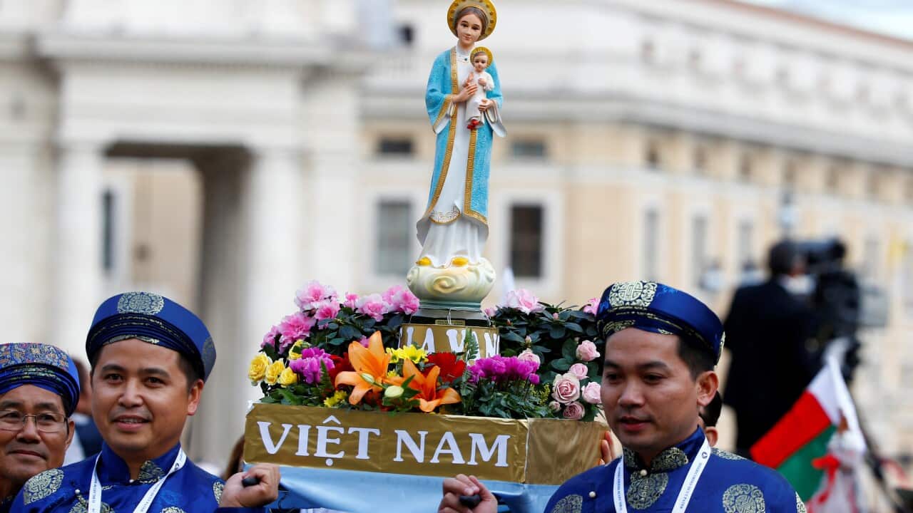 FILE PHOTO: Pilgrims from Vietnam hold a statue of Our Lady during a Marian vigil prayer led by Pope Francis in Saint Peter's square at the Vatican