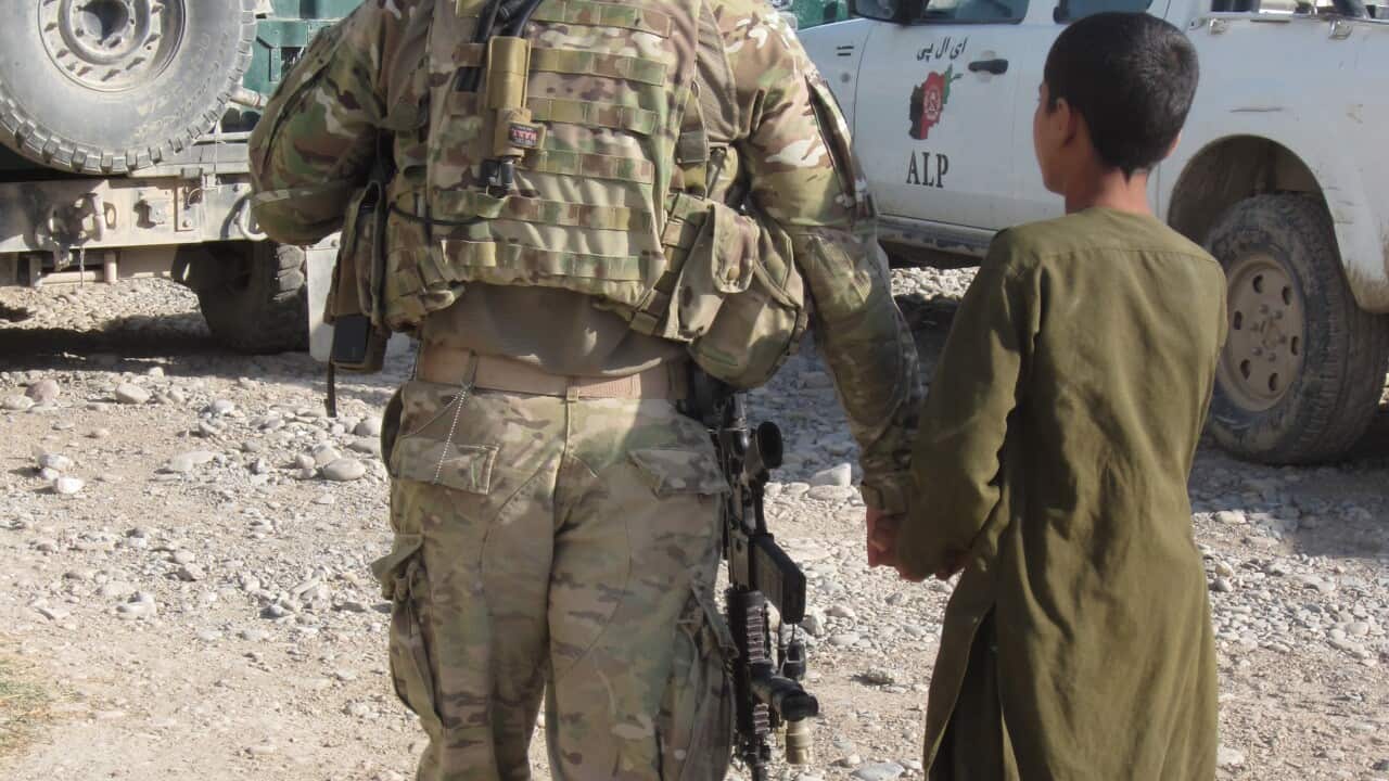 American soldier with Afghan child. (Image: Karen Middleton)