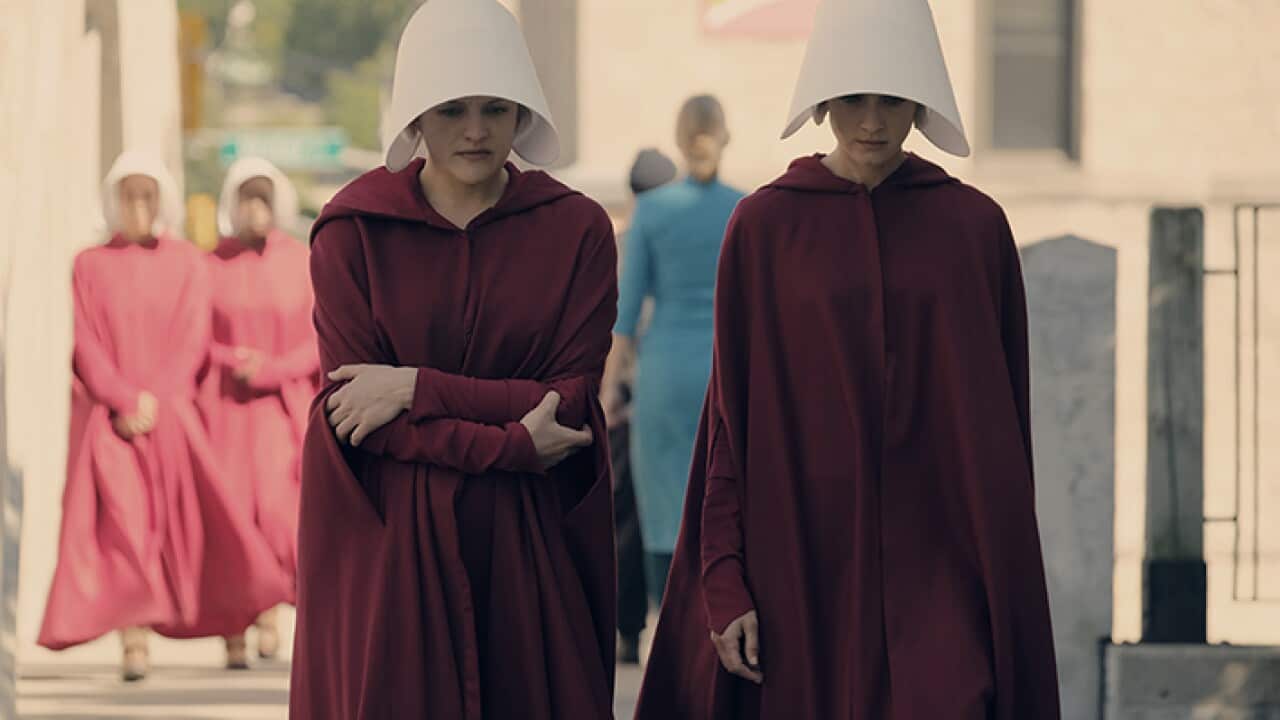 Offred (left) struggles to survive as a reproductive surrogate for a powerful Commander and his resentful wife.