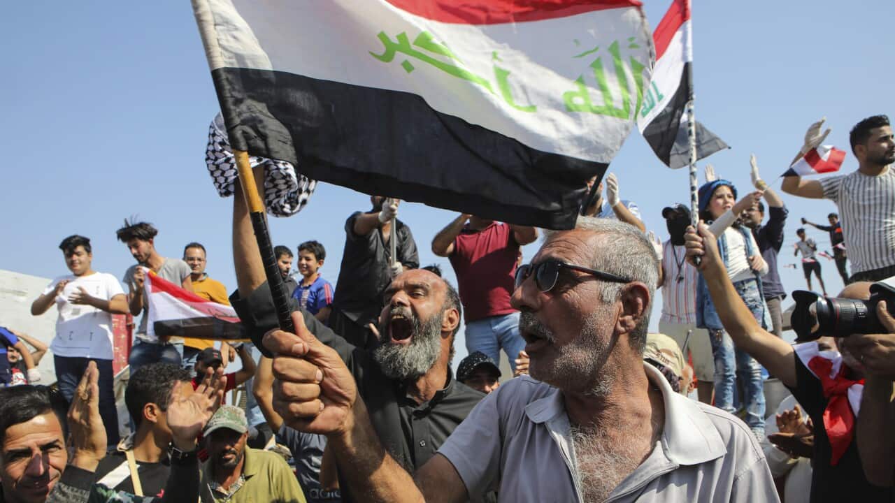 Anti-government protesters block the port of Umm Qasr.