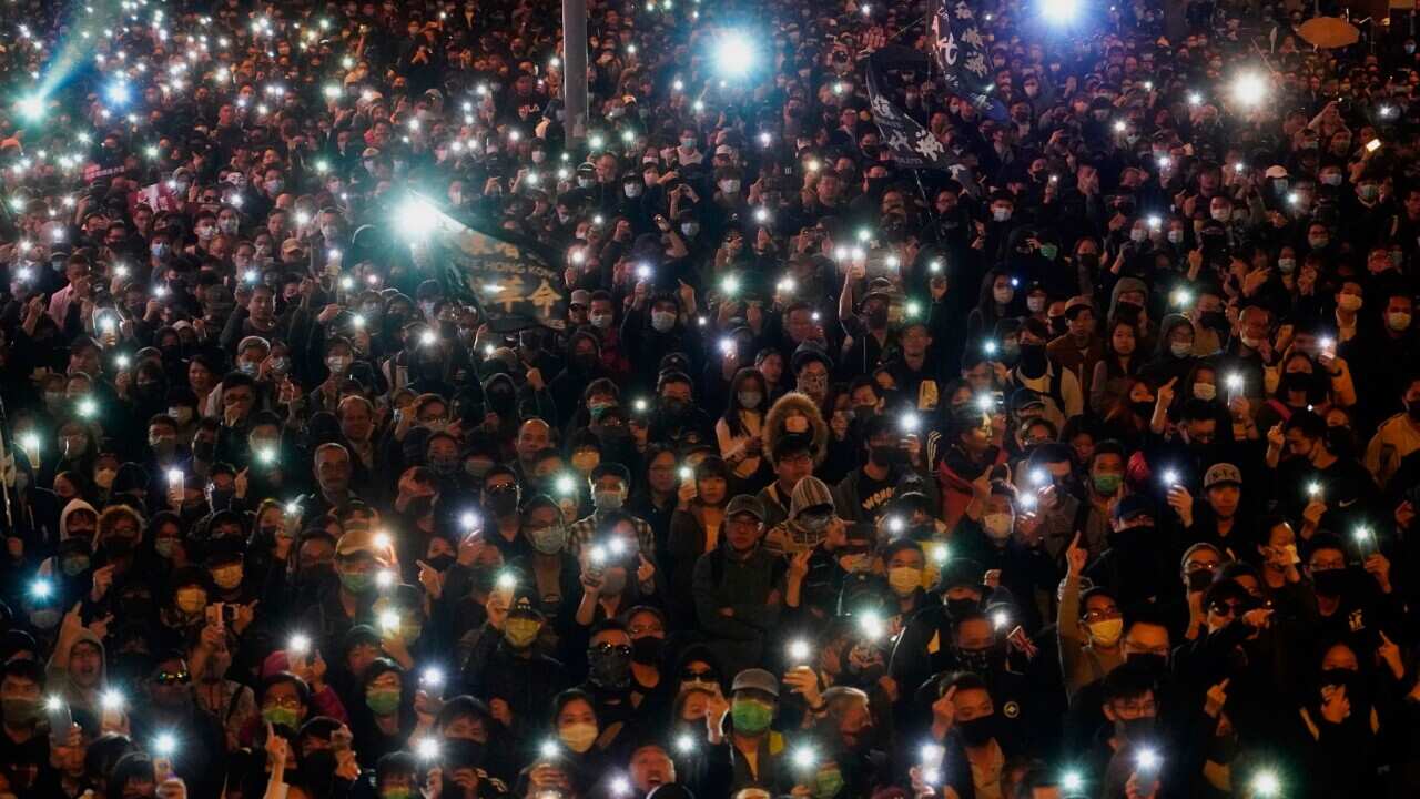 Pro-democracy protesters gather on a street in Hong Kong