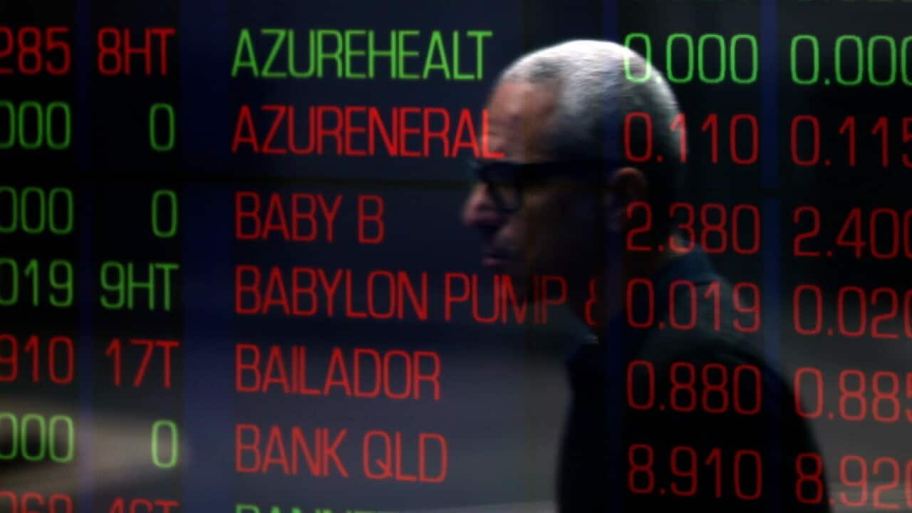 A man walks past the Australian Stock Exchange