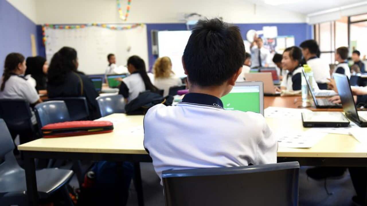 Students attend a class at Alexandria Park Community School in Sydney on Wednesday, May 4, 2016. (AAP Image/Paul Miller) NO ARCHIVING