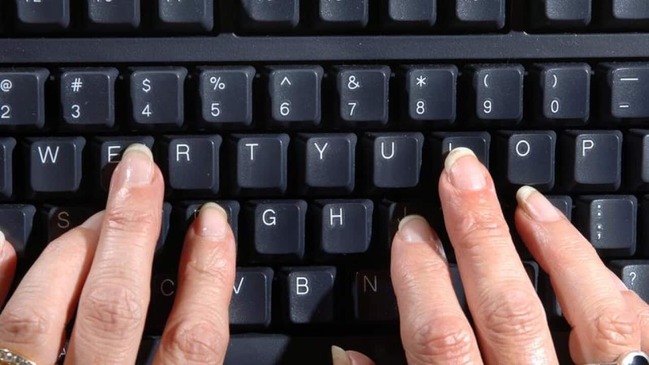 Woman's hands on computer keyboard