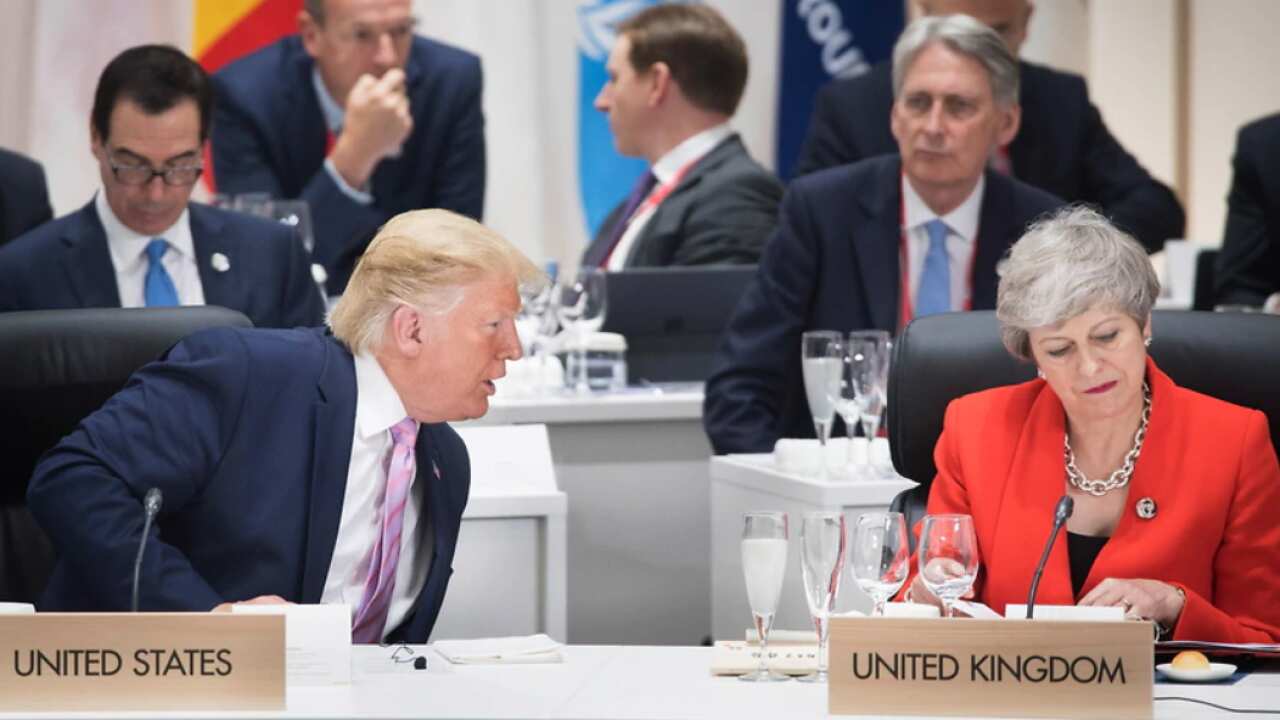 S President Donald Trump chats with British Prime Minister Theresa May at the first working session of the G20 Summit in Osaka