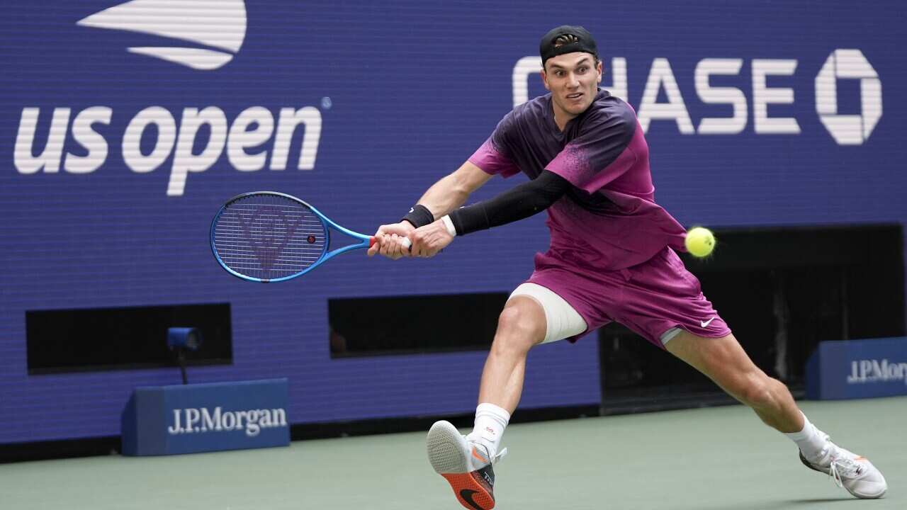 Jack Draper, of Great Britain, returns a shot to Alex de Minaur of Australia, during the quarterfinals of the 2024 U.S. Open tennis championships