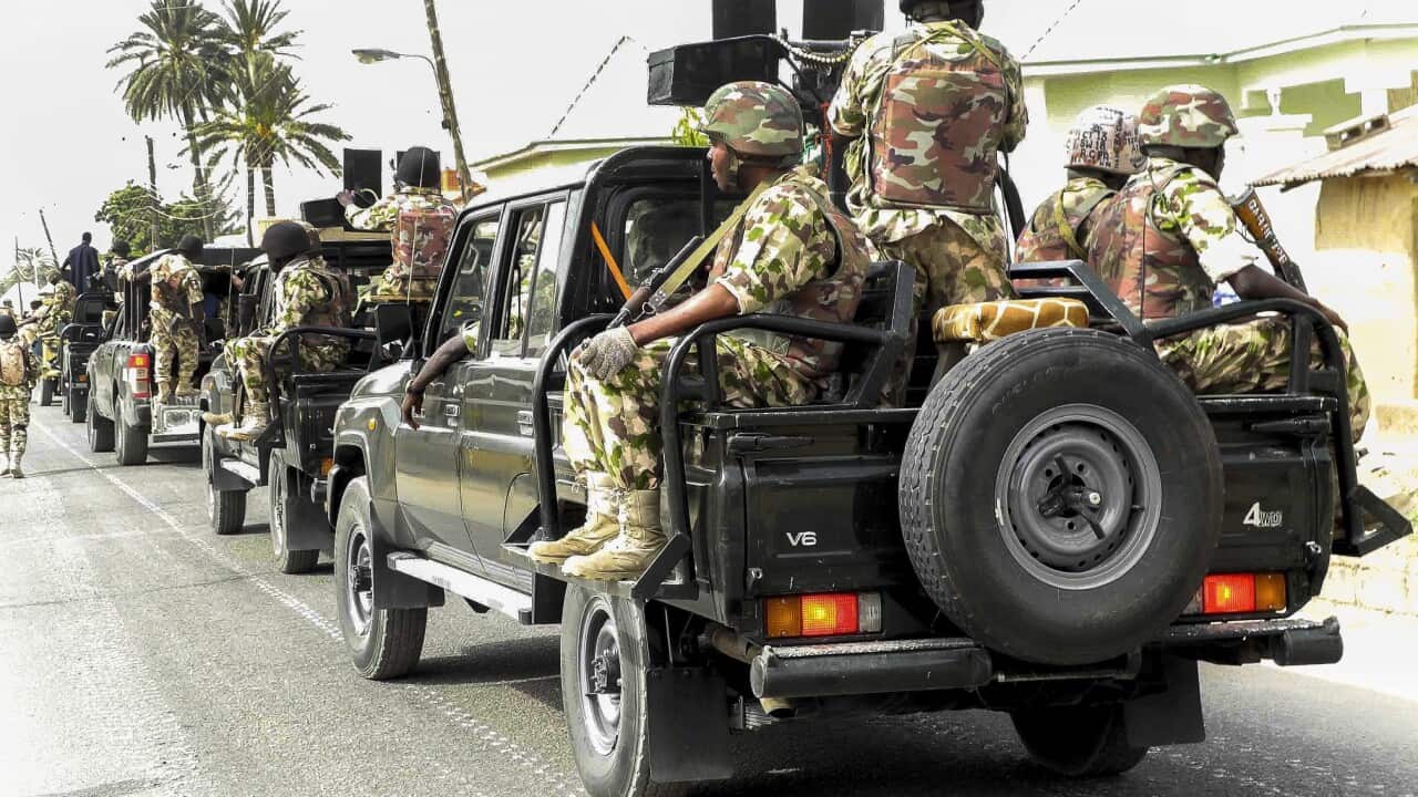 A photograph made available on 25 March 2015 shows the Nigerian military on patrol after flushing out Boko Haram Islamic militants from Michika, North East Nigeria, 19 March 2015 (EPA/STR)
