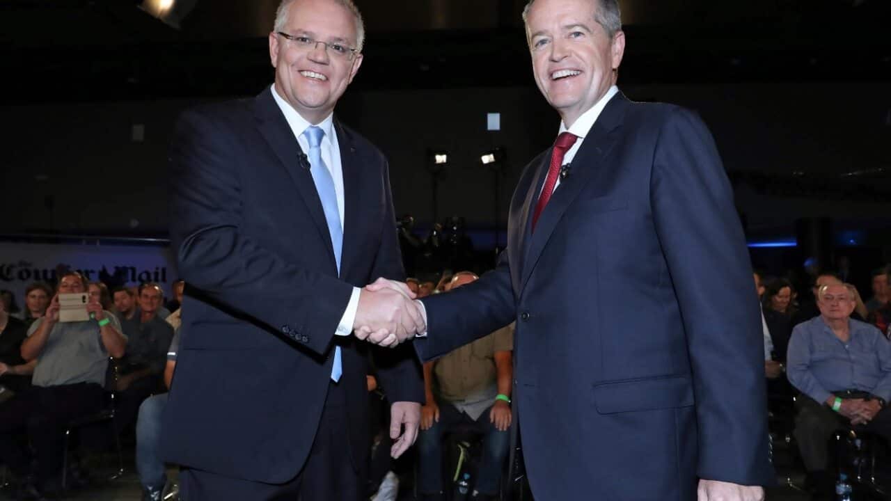 Australian Prime Minister Scott Morrison, left, and opposition leader Bill Shorten shake hands before the Sky News/Courier Mail People's Forum in Brisbane.