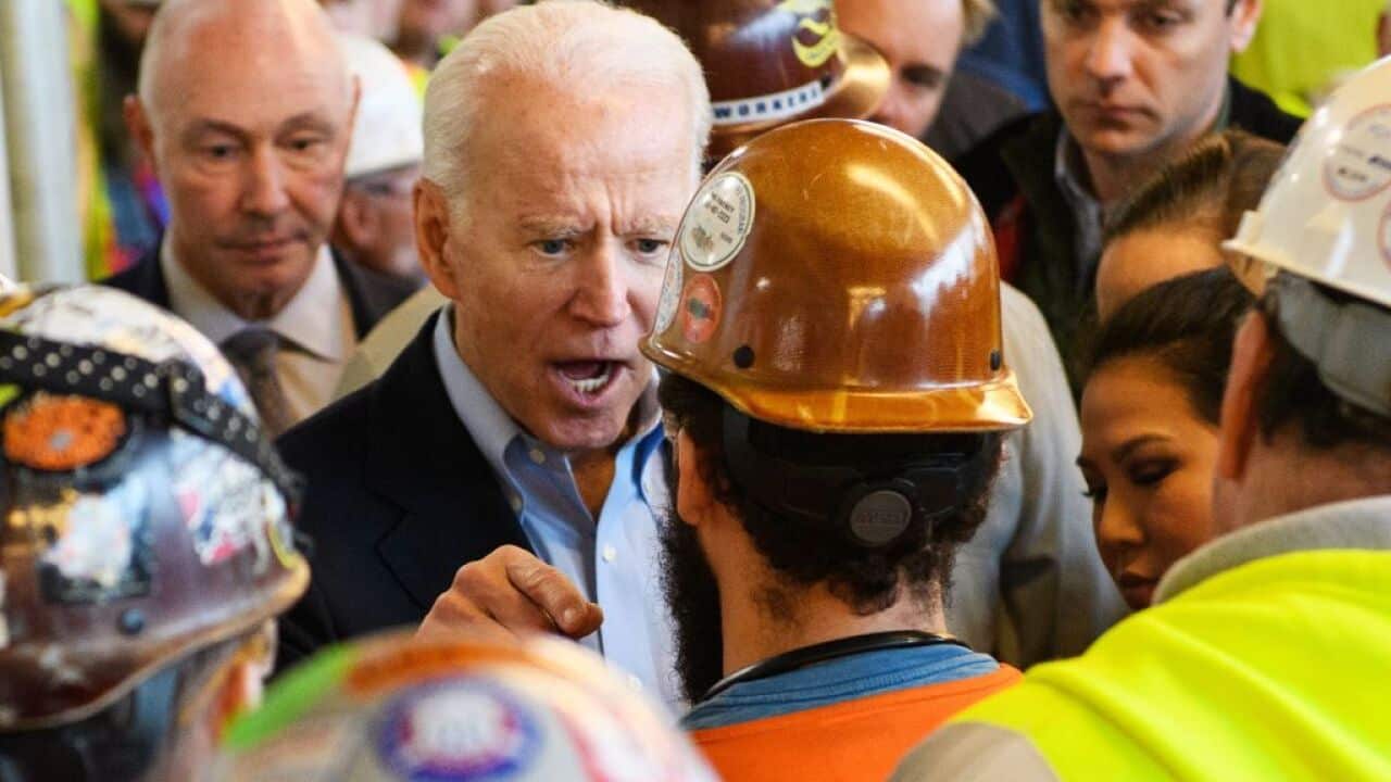 Democratic presidential candidate Joe Biden has a heated exchange as he meets workers and discusses gun rights at a Fiat Chrysler plant tour
