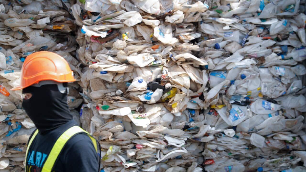 A container is filled with plastic waste from Australia, in Port Klang, Malaysia (AAP).