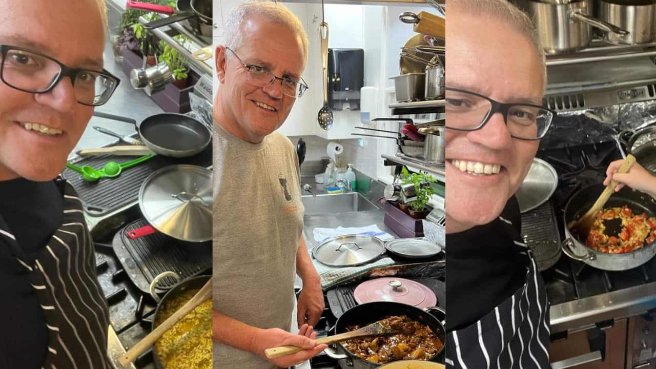 Scott Morrison takes a photo with curry.