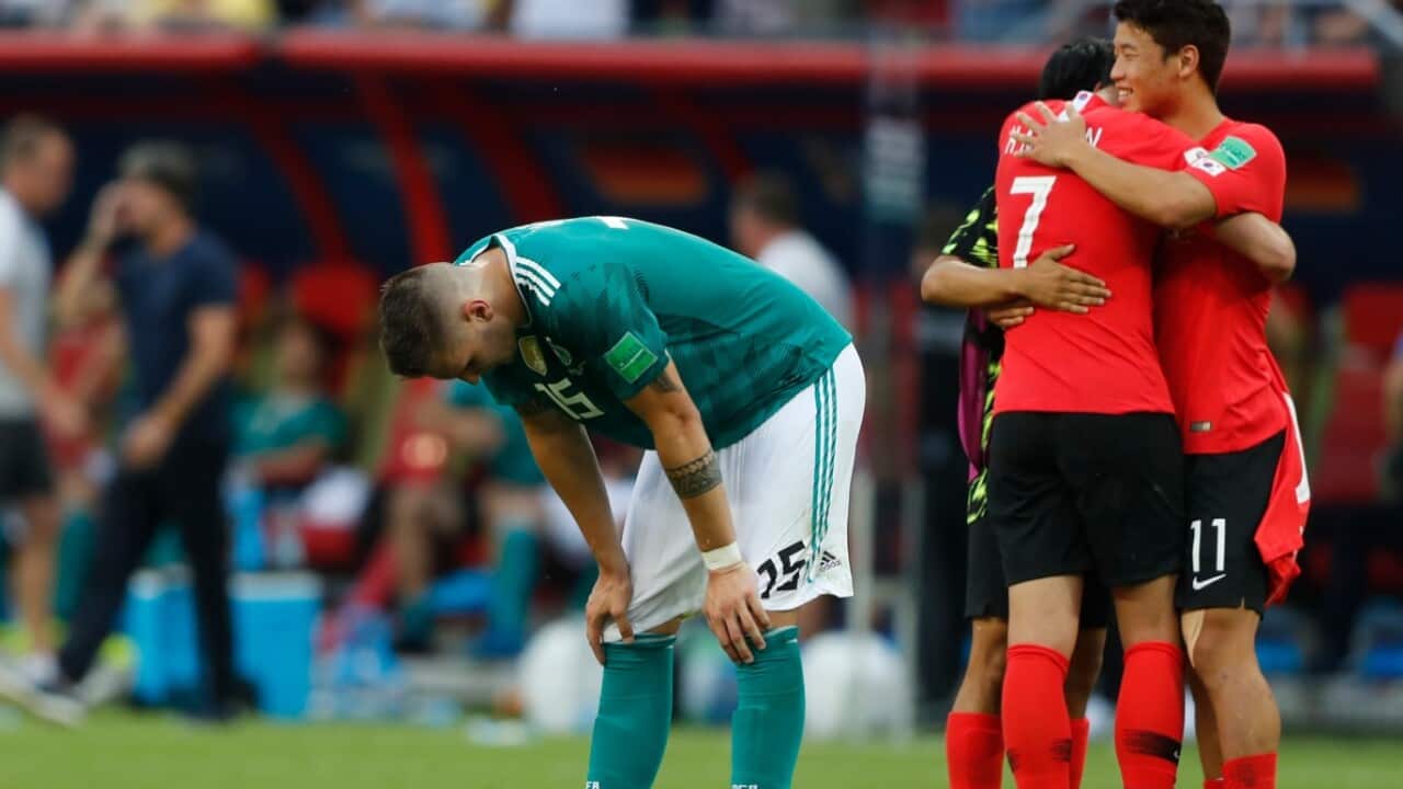 Germany's Niklas Suele, left, is dejected as South Korea's Son Heung-min, right, celebrates after the group F match between South Korea and Germany